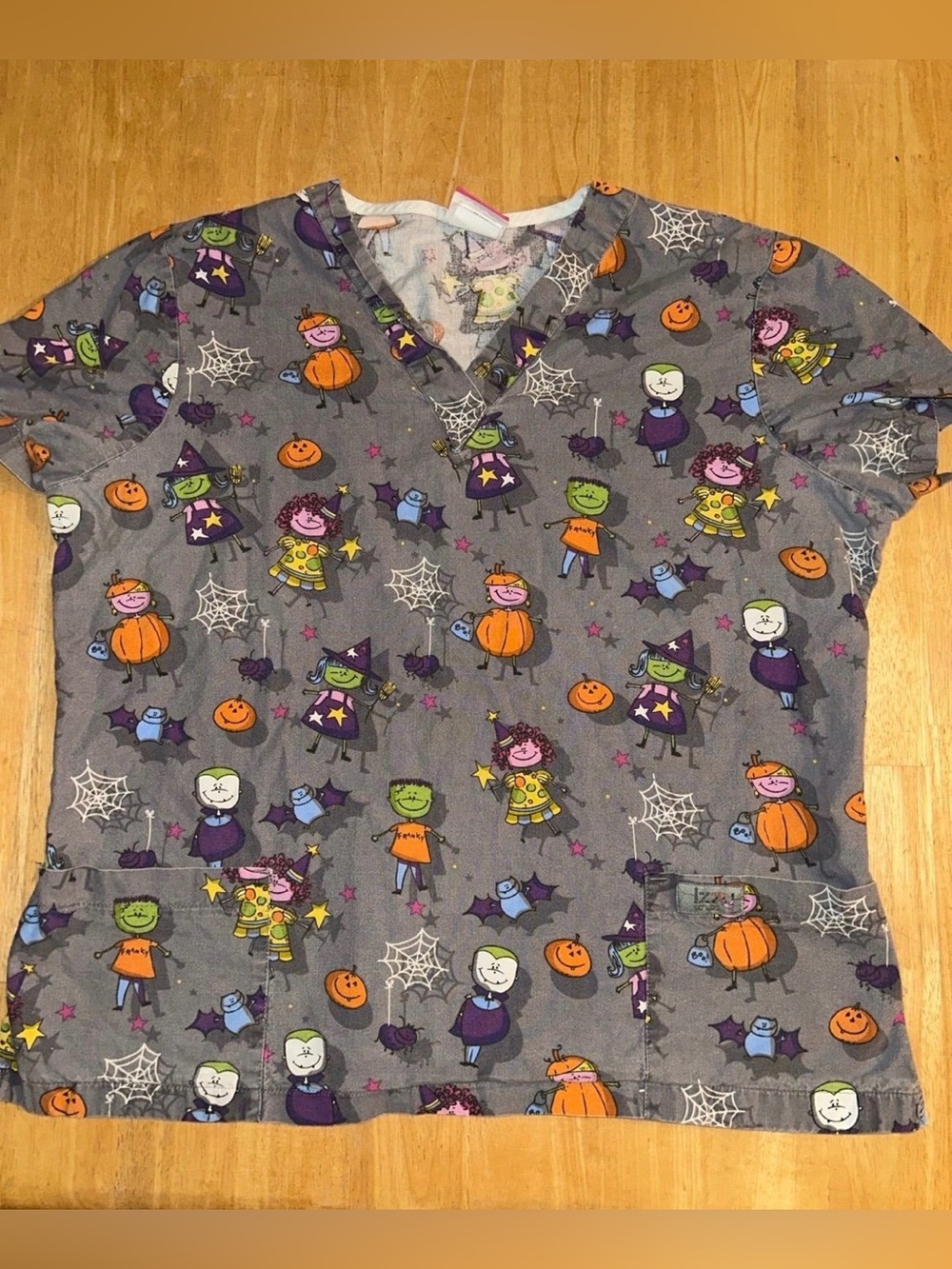 Izzy scrubs Halloween pumpkins monsters witch Frankenstein woman’s large top